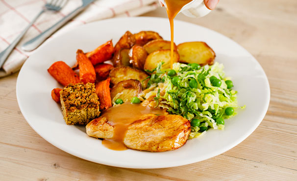 roast-dinner-with-gravy-being-poured-on